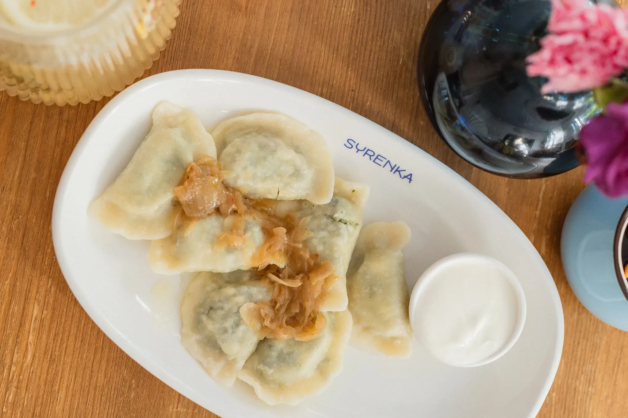 Pierogi ze szpinakiem i smietana - Restauracja Syrenka Kołobrzeg
